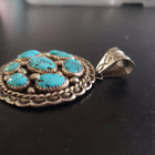Vintage Navajo sleeping beauty turquoise round sterling silver pendant
