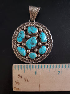 Vintage Navajo sleeping beauty turquoise round sterling silver pendant