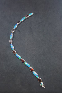 Oval Garnet with Waves Blue Fire Opal sterling silver link bracelet