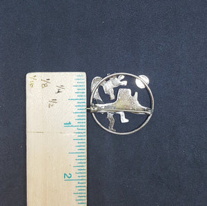 Vintage Navajo Kokopelli, Mountain, and Moon round shape sterling silver lapel pin