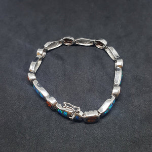 Oval Garnet with Waves Blue Fire Opal sterling silver link bracelet