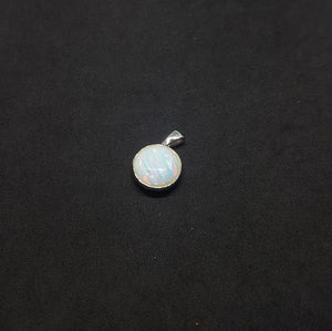 Reversible round pendant white fire opal blue fire opal